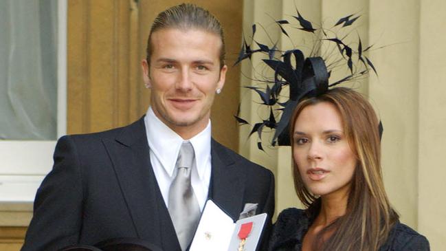 Becks got his honour from The Queen in November, 2003 with Posh proudly by his side. Picture: AFP