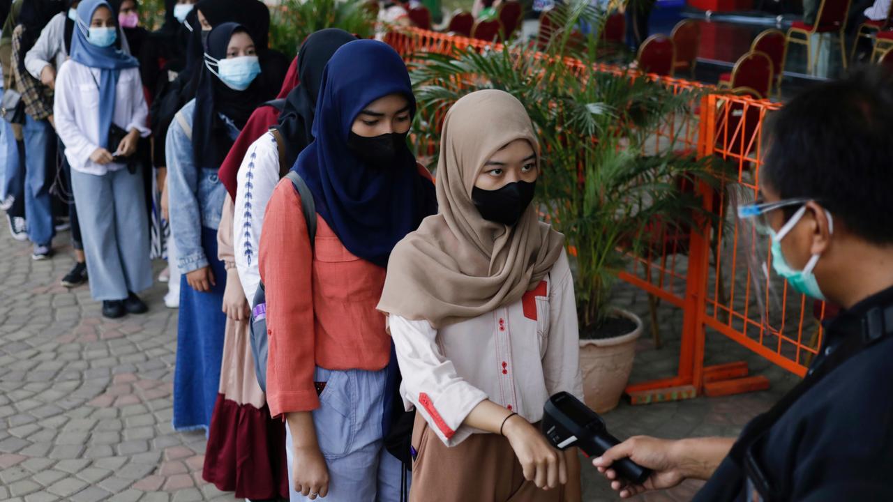 The looming restriction comes as Indonesia has hit a fully vaccinated rate of 33.1 per cent. Picture: Reuters/Willy Kurniawan.