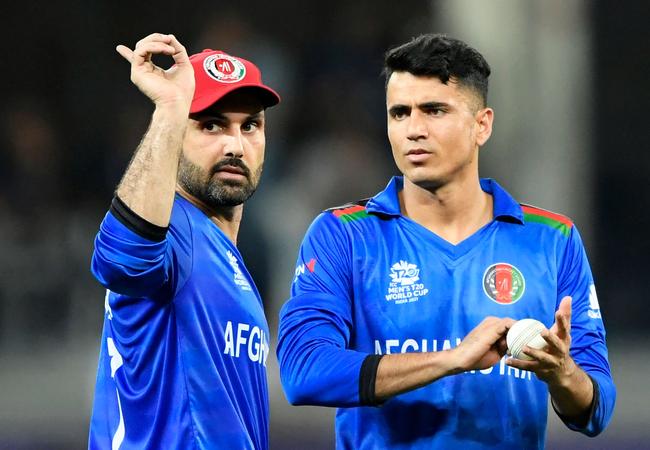 Afghanistan captain Mohammad Nabi (L) with Mujeeb Ur Rahman (Photo by Aamir QURESHI/AFP)