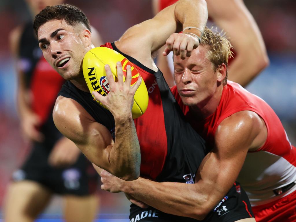 Jade Gresham is tackled by Isaac Heeney. Picture: Mark Metcalfe/AFL Photos/via Getty Images.