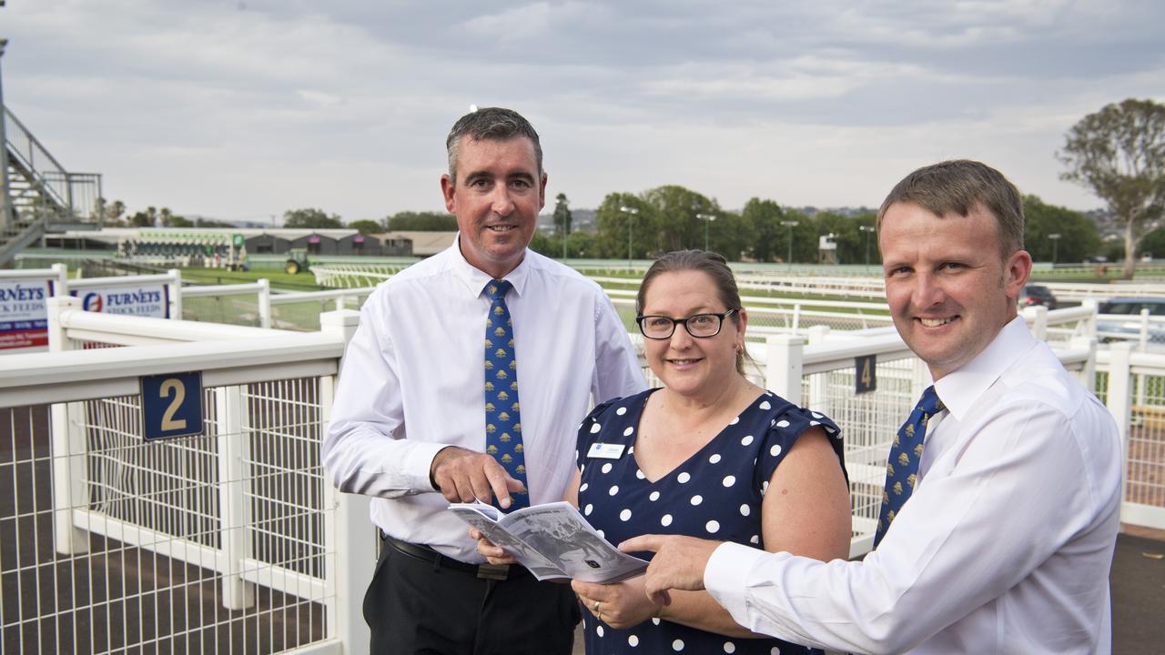 Studying the Clifford Park race form last Saturday are (from left) Ben Hall, Toowoomba Turf Club chief executive officer Lizzy King and Anthony Collins. Picture: Kevin Farmer