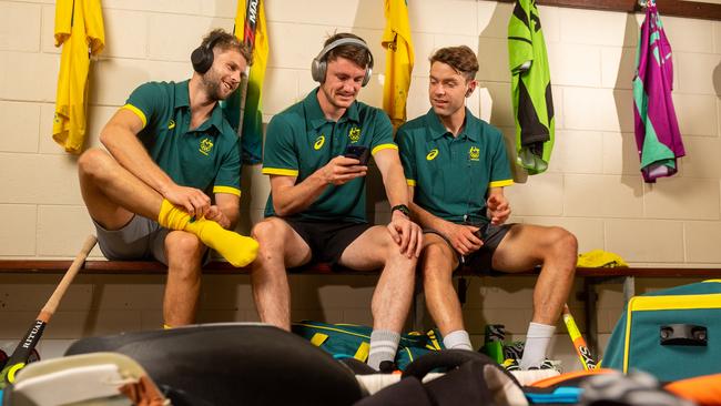 The Kookaburras are in Darwin for training before heading off to Japan for the 2020 Olympics. Josh Beltz, Dylan Martin and Flynn Ogilvie warm up with some tunes in the changerooms before heading out in the Darwin heat. Picture: Che Chorley