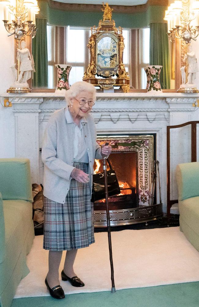 The Queen’s hand appears bruised as Her Majesty holds a walking stick. Picture: Jane Barlow / POOL / AFP