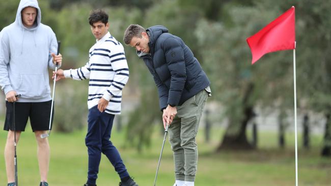 Paul Seedsman on the green with Reilly O’Brien and Shane McAdam. Picture: Tait Schmaal