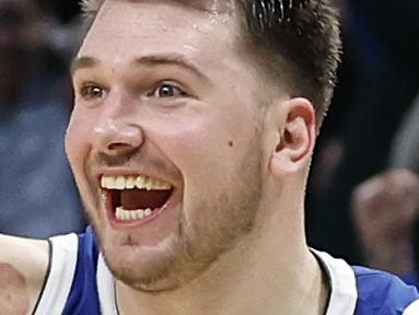 DALLAS, TEXAS - DECEMBER 27:  Luka Doncic #77 of the Dallas Mavericks reacts after making the game tying basket against the New York Knicks with one second left in regulation to send the game to overtime at American Airlines Center on December 27, 2022 in Dallas, Texas. NOTE TO USER: User expressly acknowledges and agrees that, by downloading and or using this photograph, User is consenting to the terms and conditions of the Getty Images License Agreement.  (Photo by Tim Heitman/Getty Images)