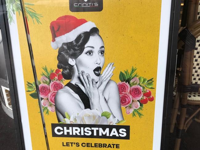 A poster promoting Christmas lunches at the closed Criniti's restaurant at Manly on Thursday morning. Picture: Jim O'Rourke