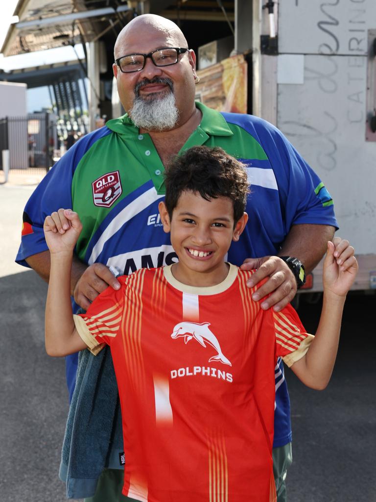 Dolphins fan Dwayne Salam, 9, and his father Thomas Salam was at Barlow Park to cheer on their team in the NRL preseason match against the North Queensland Cowboys. Picture: Brendan Radke