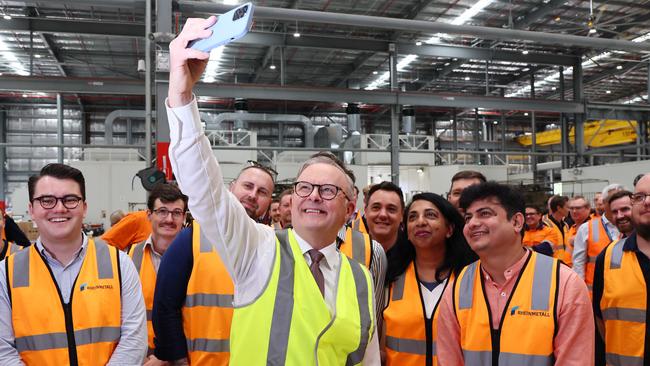 Anthony Albanese takes a selfie with workers during a visit to the Rheinmetall factory in Ipswich on Tuesday. Picture: Tertius Pickard / NCA NewsWire