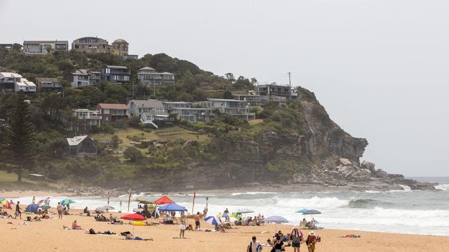 People on the beach at Whale Beach on Sydney's Northern Beaches. Picture: Damian Shaw