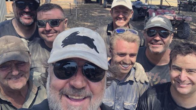 Russell Crowe with neighbours in burnt areas of Nana Glen.