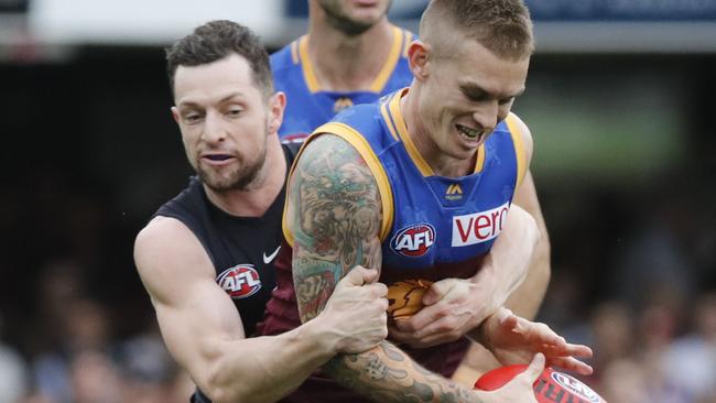 Dayne Beams is tackled by Darcy Lang.