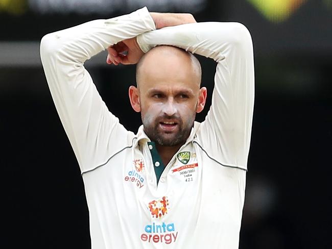 BRISBANE, AUSTRALIA - JANUARY 17: (EDITORS NOTE: Retransmission with alternate crop.) Nathan Lyon of Australia of Australia shows his frustration during day three of the 4th Test Match in the series between Australia and India at The Gabba on January 17, 2021 in Brisbane, Australia. (Photo by Jono Searle/Getty Images)