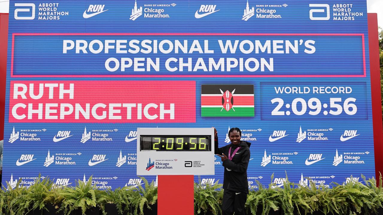 CHICAGO, ILLINOIS - OCTOBER 13: Ruth Chepngetich of Kenya poses with the clock.