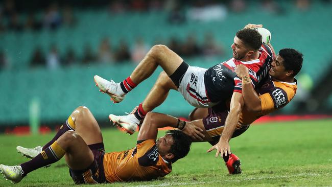 Anthony Milford makes a tackle on James Tedesco. Picture. Phil Hillyard