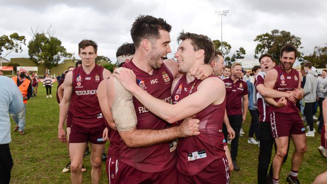 Cam Giles and Craig Pitt celebrate after winning the Adelaide Footy League division one grand final last season. The club is now in a spot where it could either make finals or be relegated. Picture: Brenton Edwards