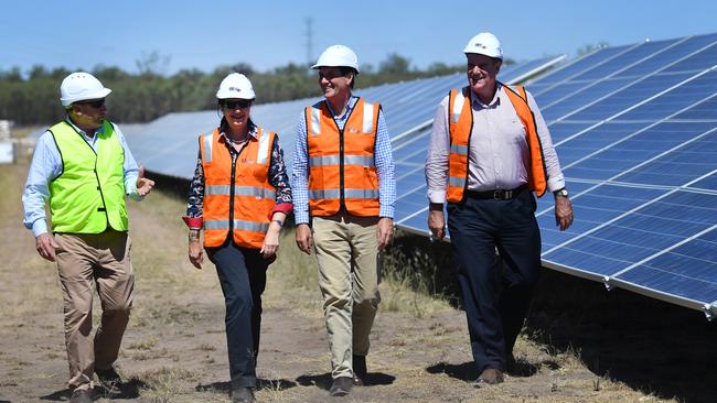 COMMUNITY CONSULTATION: Western Downs Regional Council Mayor Paul McVeigh, Premier Annastacia Palaszczuk, Minister Dr Anthony Lynham, and Minister Mark Furner at a solar farm in Miles. Picture: AAP Image/Darren England