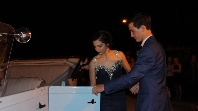 Wade Anderson helps Ellen Kehl out of the car at the St John's Formal in Roma.