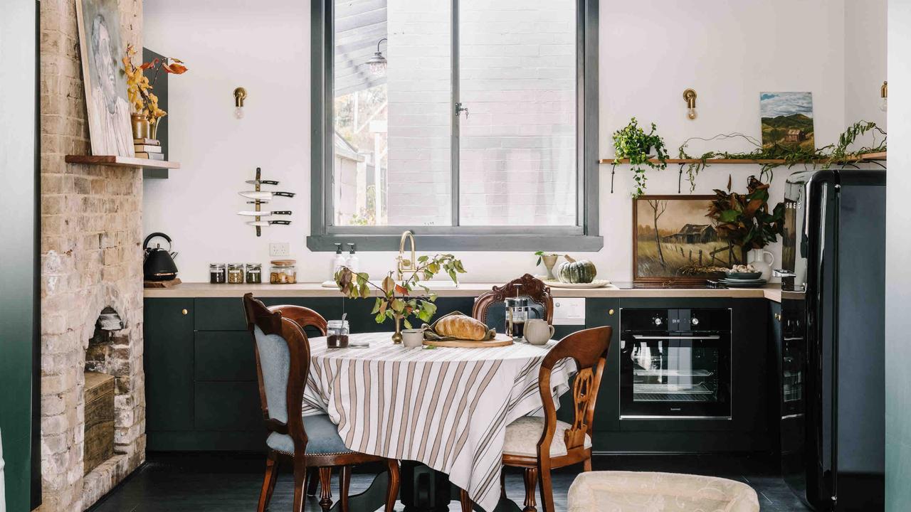 Exposed brick and old paintings in the kitchen of ‘Mister Monro’.