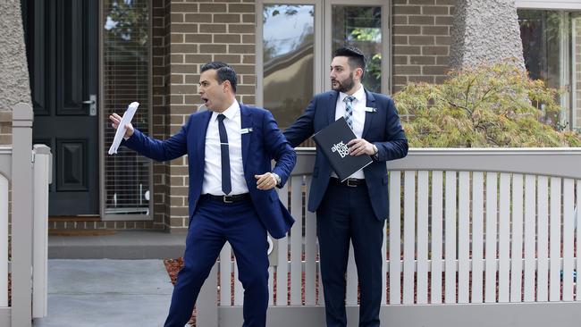 Auctioneer Charles Bongiovanni in action outside an Ascot Vale property. Picture: Sarah Matray.