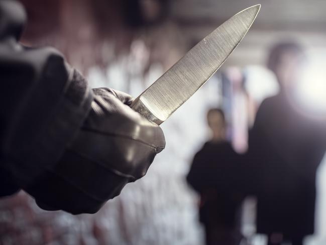 Generic crime Istock  -  Criminal with knife weapon threatening woman and child in underpass crime