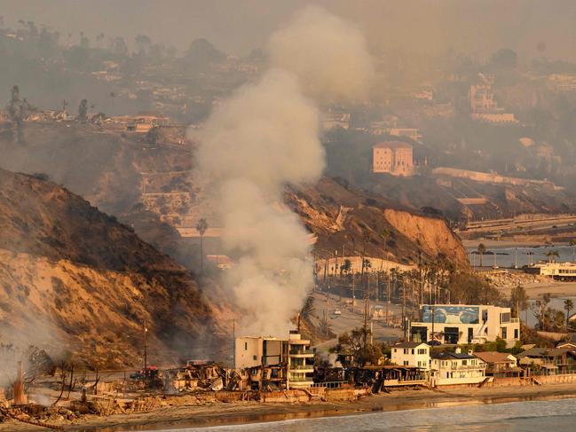 Homes burn on the Pacific Coast Highway during the Palisades fire in Malibu. Picture: AFP