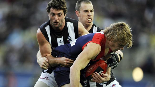 Jack Watts gets tackled by Shane O'Bree and Nick Maxwell.