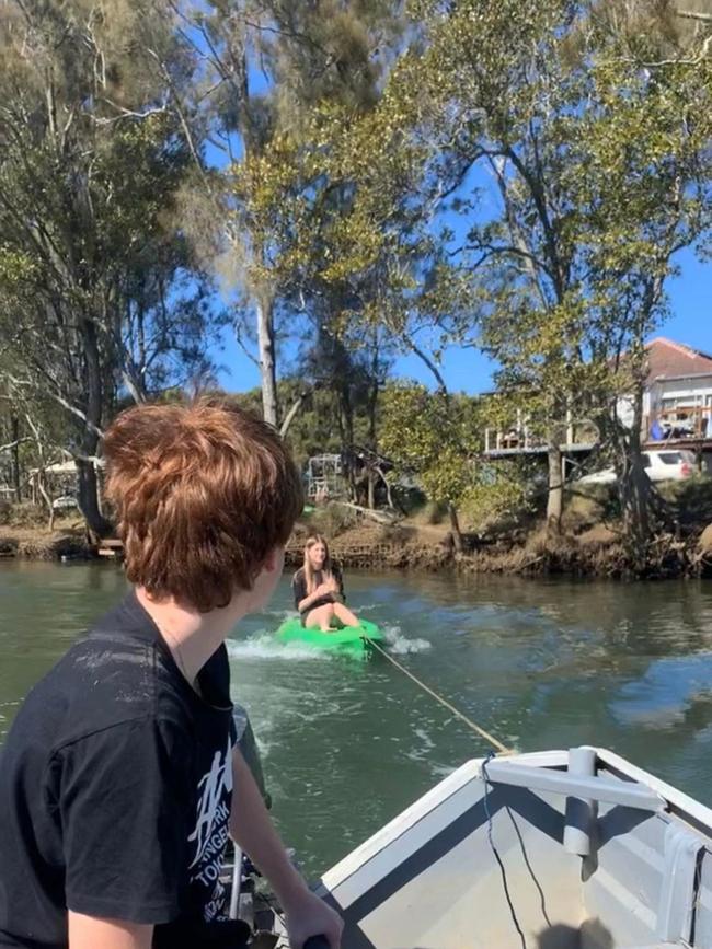 The family having fun on the water, just outside the home.