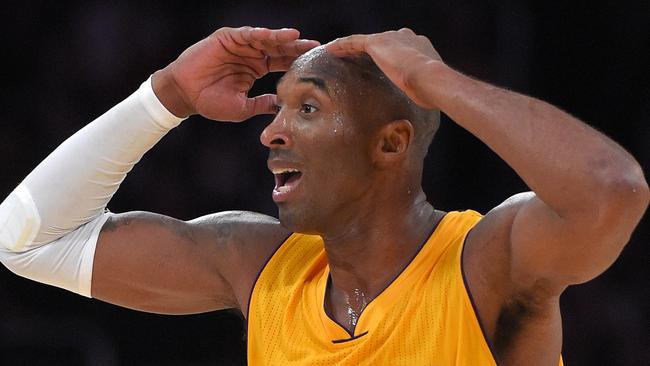 Los Angeles Lakers guard Kobe Bryant reacts after he was called for traveling during the second half of an NBA basketball game Phoenix Suns, Tuesday, Nov. 4, 2014, in Los Angeles. The Suns won 112-106. (AP Photo/Mark J. Terrill)