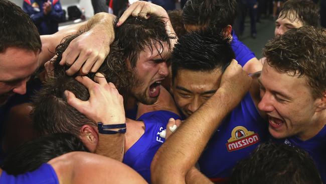 Easton Wood, Lin Jong and Jack Macrae enjoy the win.