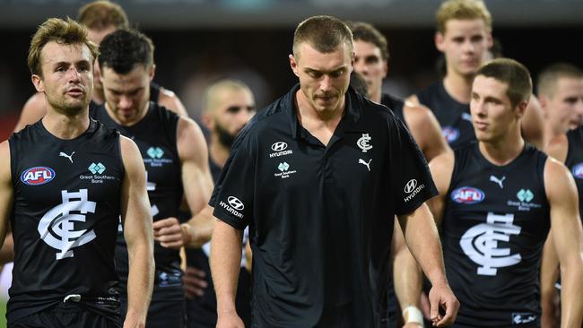 A dejected Patrick Cripps leads his team off after the Blues suffered their first loss of the season. Picture: AFL Photos/Getty Images