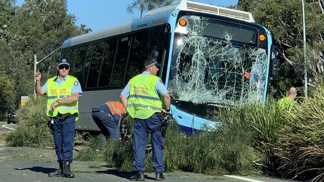 A Forest Coach Lines bus was badly damaged when it left Forest Way at Belrose and struck a number of small trees on the median strip. Picture: Ivy O’Rourke