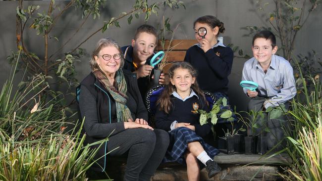 Deirdre Knight with St Joseph's School Students Nicholas, Laleia, Italica and Peter in the garden planted to bring the native butterflies back at St Joseph's School, Hindmarsh. Picture: Emma Brasier