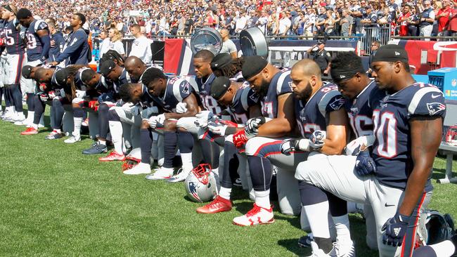 Members of the New England Patriots kneeling during the national anthem. Pic: Getty