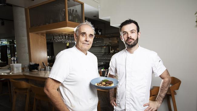 E’cco owner Phil Johnson and head chef Antoine Potier with the braised beef cheeks that would cost $38 dine-in, but only $25 takeaway. Picture: News Corp/Attila Csaszar