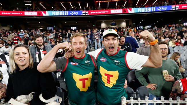 MELBOURNE, AUSTRALIA - MARCH 21: Tasmania Devils fans Bradley Cox-Goodyer (left) and Will Tatchell during the 2024 AFL Round 02 match between the St Kilda Saints and the Collingwood Magpies at the Melbourne Cricket Ground on March 21, 2024 in Melbourne, Australia. (Photo by Michael Willson/AFL Photos via Getty Images)