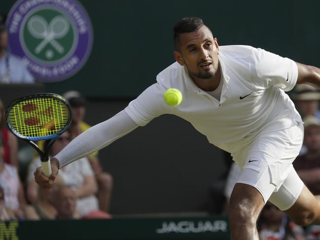 Australia's Nick Kyrgios plays a shot back to Spain's Rafael Nadal in a Men's singles match during day four of the Wimbledon Tennis Championships in London, Thursday, July 4, 2019. (AP Photo/Kirsty Wigglesworth)