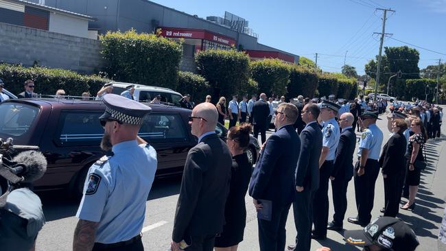 Colleagues, family and friends stood in a guard of honour as Senior Sergeant Brendan Wiblen was led out of the funeral service.