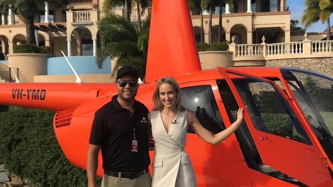 Courier-Mail reporter Elizabeth Tilley with pilot Dave arriving at Mandalay House in Airlie Beach.