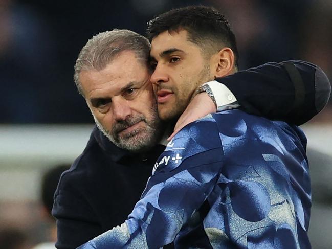 Tottenham Hotspur's Greek-Australian Head Coach Ange Postecoglou (L) celebrates with Tottenham Hotspur's Argentinian defender #17 Cristian Romero (R) on the pitch after the English Premier League football match between Tottenham Hotspur and Aston Villa at the Tottenham Hotspur Stadium in London, on November 3, 2024. Spurs won the game 4-1. (Photo by Adrian Dennis / AFP) / RESTRICTED TO EDITORIAL USE. No use with unauthorized audio, video, data, fixture lists, club/league logos or 'live' services. Online in-match use limited to 120 images. An additional 40 images may be used in extra time. No video emulation. Social media in-match use limited to 120 images. An additional 40 images may be used in extra time. No use in betting publications, games or single club/league/player publications. /