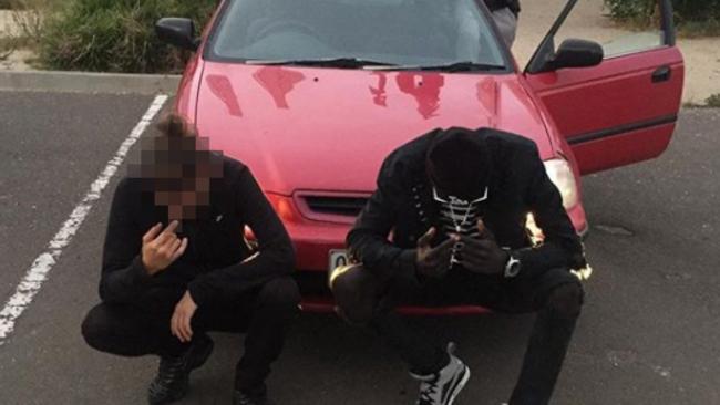 <s1>Three youths pose in front of a red car outside Ecoville Community Park in Tarneit.</s1>