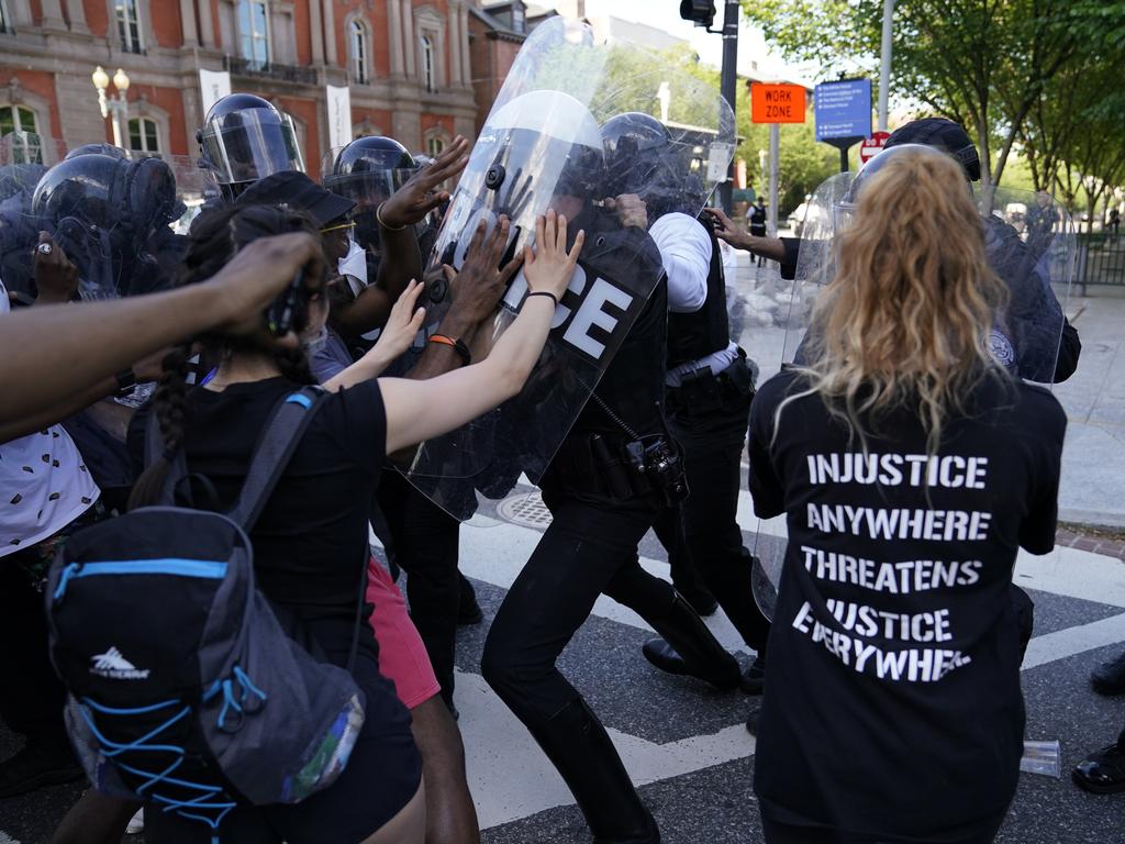 Demonstrators clash with police. Picture: Evan Vucci/AP