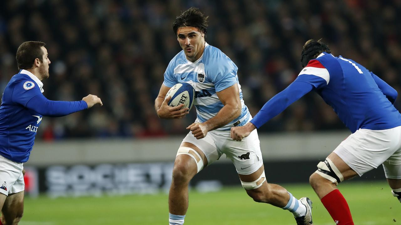 Argentina’s Pablo Matera tries to run between France's Camille Lopez and Arthur Iturria.