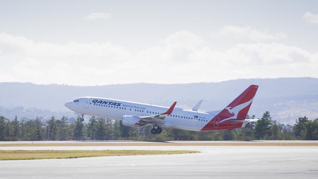 A Qantas plane takes off from Hobart Airport. Picture: RICHARD JUPE