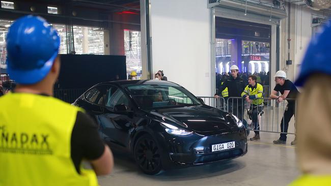 A new Tesla car leaves a German manufacturing plant. European carmakers are scrambling to lock in supply of critical minerals, including rare earths, as demand of electric cars increases. Photo by Christian Marquardt - Pool/Getty Images.