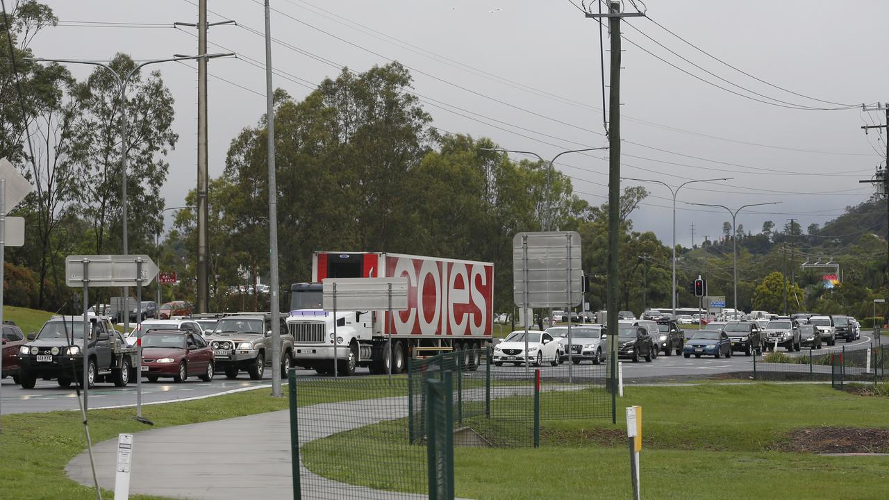 Heavy traffic near Movie World, Gold Coast, Saturday, January 18, 2020. A severe thunderstorm swept the Coast during the early hours of the day dumping 128mm of rain in an hour. (AAP Image/Regi Varghese)