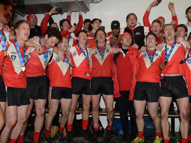 Red Hill players and supporters celebrate their grand final win last September. Picture: Chris Eastman