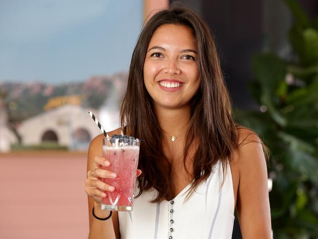 Pauline Lefur, 24, (right) with The New Guard cocktail at Hotel Ravesis at Bondi Beach. These cocktails are made with healthy ingredients such as kombucha, acai and goji berries. Picture: Jonathan Ng