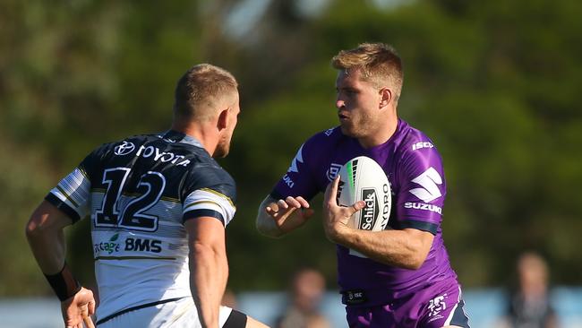 The Storm’s Cameron Munster runs with the ball during the NRL Trial match against the Cowboys at Casey Fields, Melbourne in February. Picture: Mike Owen/Getty Images