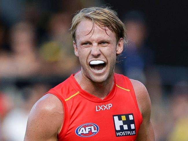 GOLD COAST, AUSTRALIA - MARCH 09: Jack Lukosius of the Suns celebrates a goal during the 2024 AFL Opening Round match between the Gold Coast SUNS and the Richmond Tigers at People First Stadium on March 09, 2024 in Gold Coast, Australia. (Photo by Russell Freeman/AFL Photos via Getty Images)