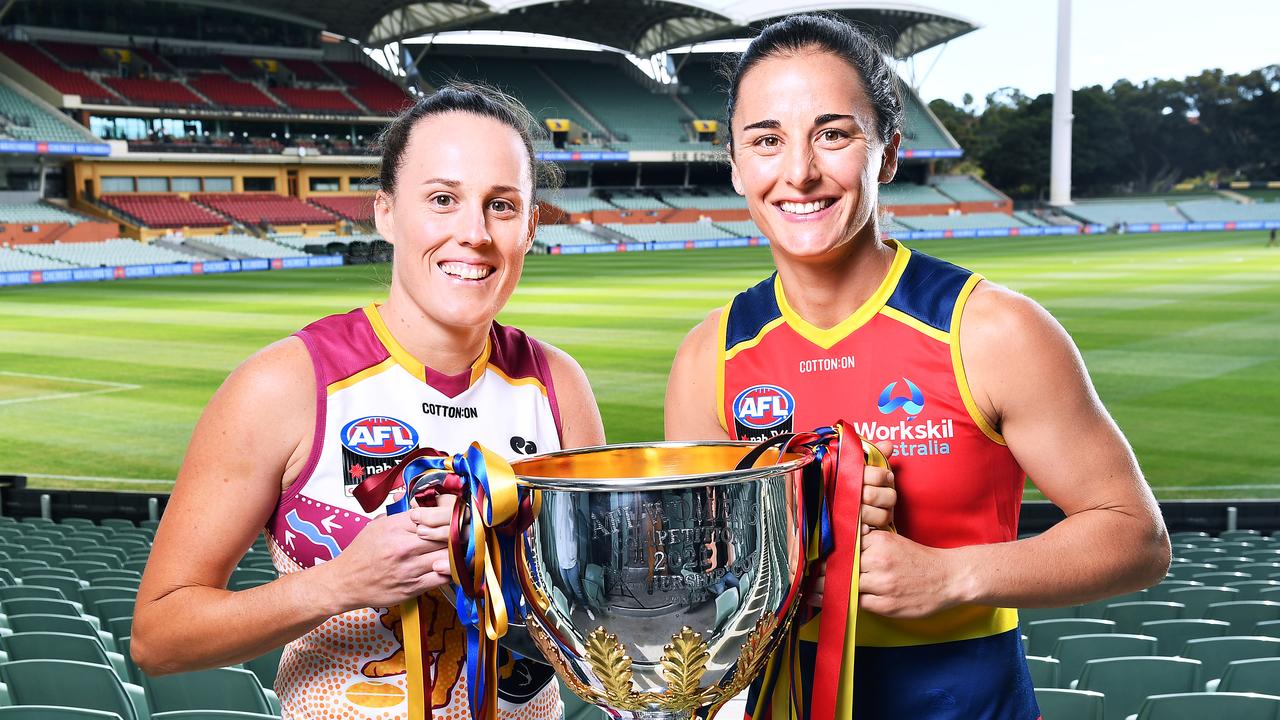 ADELAIDE, AUSTRALIA - APRIL 16: Emma Zielke captain of the Lions and Angela Foley Grand Final captain of the Crows pose with the AFL Womens Premiership Trophy during an AFLW Grand Final media opportunity at the Adelaide Oval on April 16, 2021 in Adelaide, Australia. (Photo by Mark Brake/Getty Images)